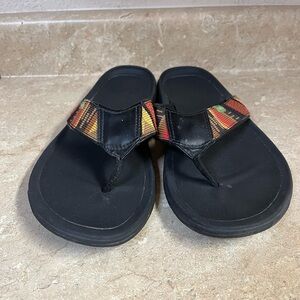 Black Sanuk Flip Flop Sandals with Red, Yellow, Green Stripe Accent
